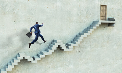 Image of businessman walking upstairs