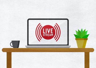 "Live stream" Laptop on a table with a mug and a plant 
