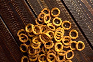 Traditional russian small bagels on dark rustic table background, top view