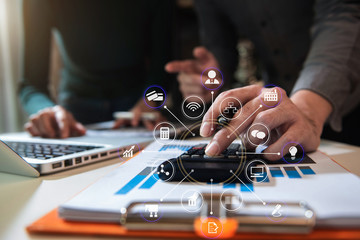 Business team meeting present.professional investor working with new startup project. Finance managers task.Digital tablet laptop computer design smart phone in morning light.