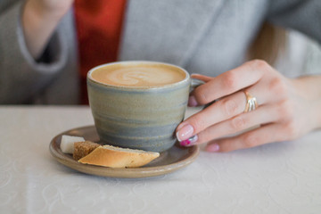 woman holding a cup of coffee