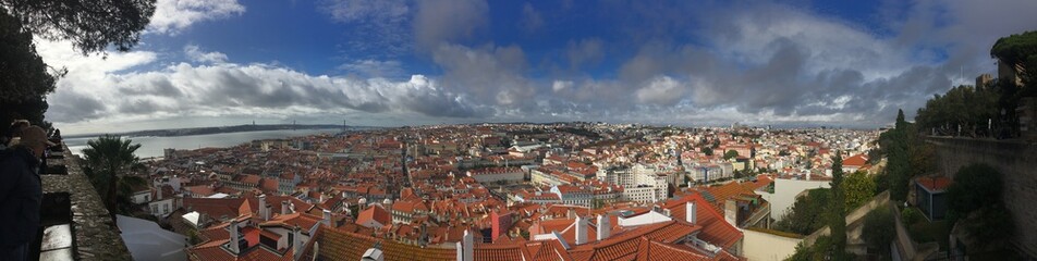 Naklejka na ściany i meble view of Lisbon from Castelo de S. Jorge - November 2019 - blue sky, sun and clouds
