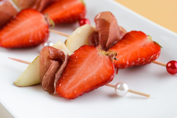 Canape with prosciutto and strawberries