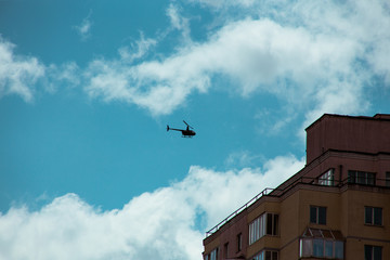 Fluffy clouds cover the summer blue sky