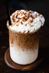 Latte coffee topped with whipping cream
