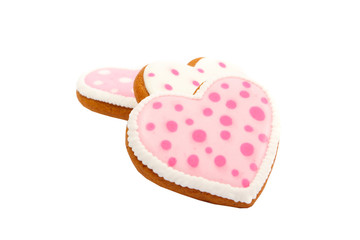 background from pink cookies heart shaped with different patterns, isolated on the white