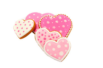 background from pink cookies heart shaped with different patterns, isolated on the white