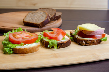 sandwiches with vegetables, cheese and meat close-up