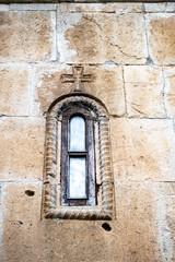 Fototapeta na wymiar Window in the outer wall of the monastery of Ghelati.