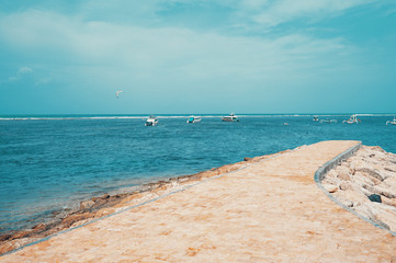 Views of the beach, blue sky and several ships on sanur beach