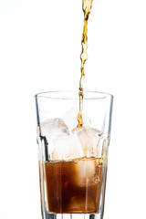 cocktail with ice and cola in a glass on a white background, you can add rum or whiskey