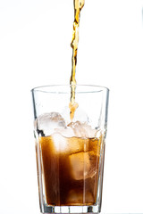 Fototapeta na wymiar cocktail with ice and cola in a glass on a white background, you can add rum or whiskey
