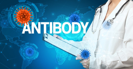 Doctor fills out medical record with ANTIBODY inscription, virology concept