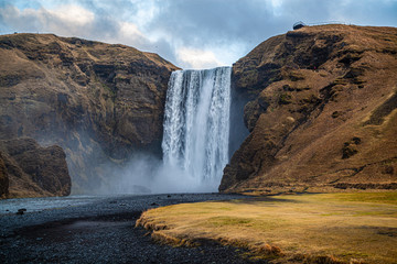 Stunning view of the famous Skogafoss waterfall, Iceland. Hydro energy. Power of water.