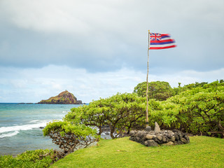 Koki Beach Park Maui. The dark red sand at Koki Beach was produced by the nearby cinder cone hill of Ka Iwi O Pele. Koki Beach is one of two famous Hana surf breaks and favorite spot for local surfers