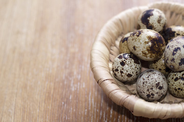 Fototapeta premium Quail eggs in a basket