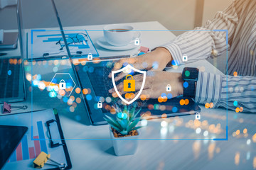 Person using a laptop computer with technology cybersecurity and privacy concept. protection and safe data for global network security.