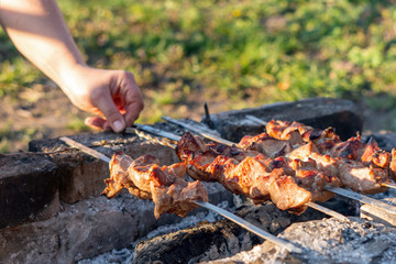 Delicious, juicy, pickled kebab is grilled on charcoal