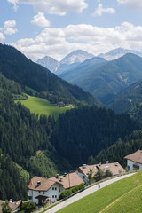 Fototapeta na wymiar The panoramic view of a valley in Trentino during summer season , San Lorenzo di Sebato, Italy