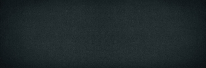 Fototapeta premium Black fine textured paper surface widescreen background. Dark wide texture