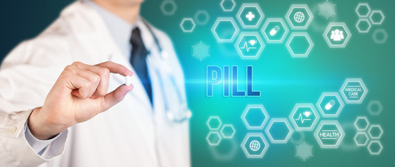 Close-up of a doctor giving you a pill with PILL inscription, medical concept