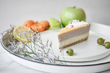 Piece of cake and fruits