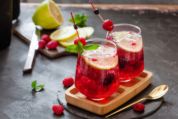 Raspberry homemade lemonade with fresh mint and lemon