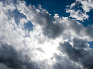 The background of sun rays over clouds. The sun rays break over the clouds.