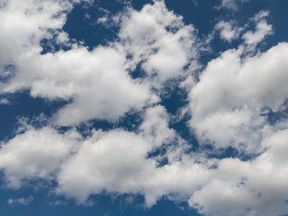 Blue summer sky white cumulus clouds background