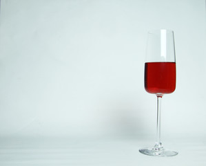 a glass of red wine isolated on white background