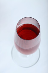 a glass of red wine isolated on white background flat lay