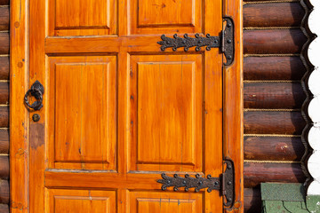vintage wooden door in retro style in a modern log house