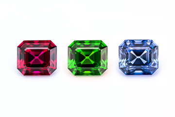Red green and blue precious gemstones on a white background