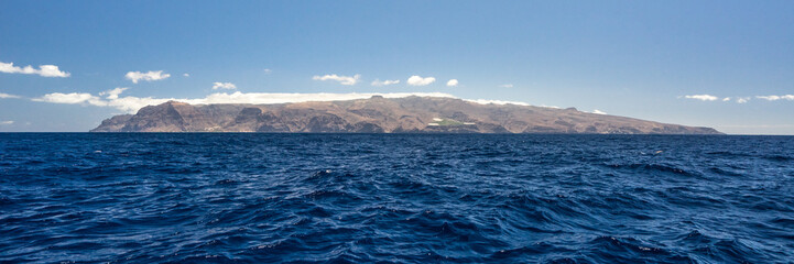 island silhouette of la Gomera from a boat in the ocean