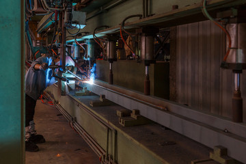 Modern semi-automatic robotic welding machine in a metal factory manufacturing plant, Xiamen, China