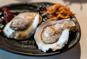 Fresh oyster served in thai style seafood with chili paste and fried onion.