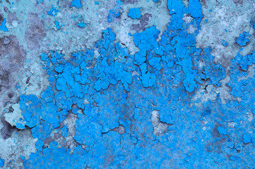 Blue peeling plaster on a gray wall. Abstract texture, Wallpaper.