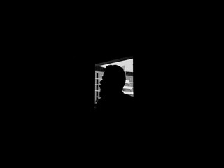 silhouette of a man in a doorway