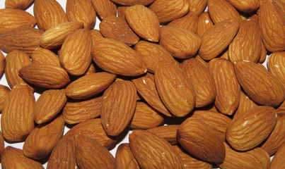 Isolated Almonds on a white background, Almonds on a white background, Close up of  Almonds.
