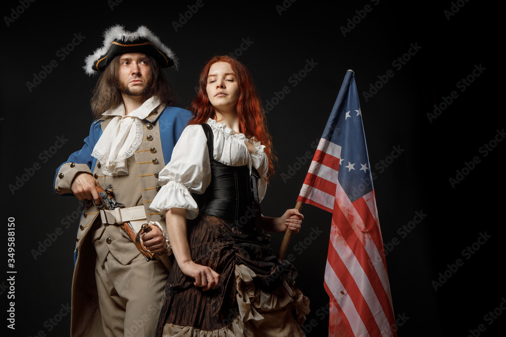 Poster Man in form of officer of United States War of Independence and girl in historical dress of 18th century. July 4 is US Independence Day. Studio photo on black background