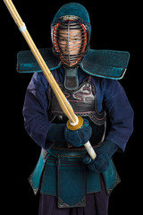 Portrait of man kendo fighter with shinai (bamboo sword). Shot in studio. Isolated with clipping...