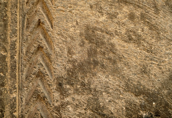 Detail of a sandstone relief. Centuries old ornamental art.