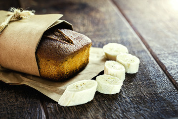homemade banana cake with oats, on a rustic wooden background. Organic product.