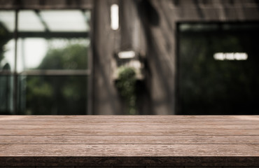 Empty old wood table top with bokeh coffee shop interior background