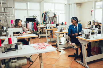 Dressmaker woman working with sewing machine