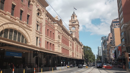 Under the clock at Flinder Street station with the view to the city trams from Degrave street, Melbourne