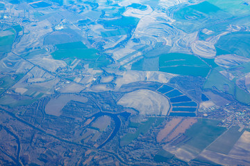 flying over the lakes and green fields