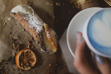 blue tea matcha in a white mug on the table.