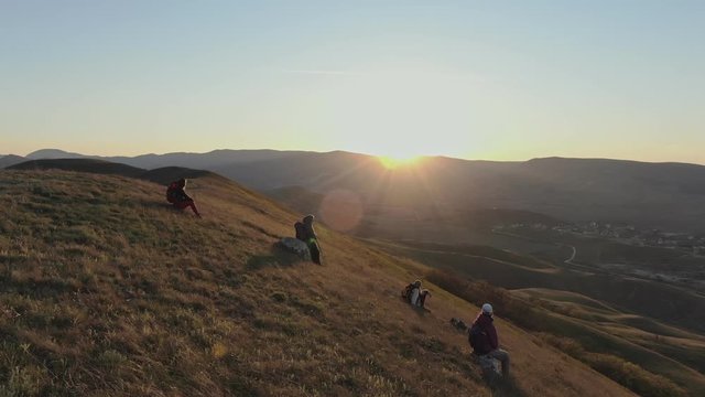 Travelers enjoying the sunset in mountains Conception The people enjoying with the existing idyllic Quiet surround Aerial drone shot