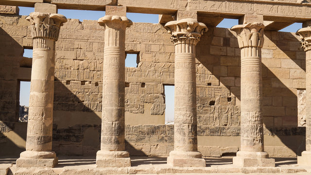 Beautfil Philae temple Egypt architecture hieroglyphic and column in  Aswan sunny blue sky